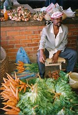 A vendor selling vegetables at Blantyre market